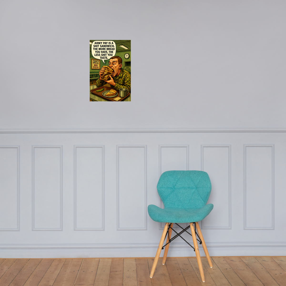 Army Pay Is a Shit Sandwich: 12 in by 18 in glossy poster on a paneled wall above a turquoise chair; Printful room mockup.