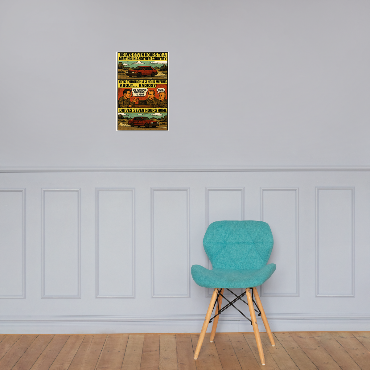 Drives Seven Hours to a Meeting in Another Country: 12 in by 18 in glossy poster on a paneled wall above a turquoise chair; Printful room mockup.