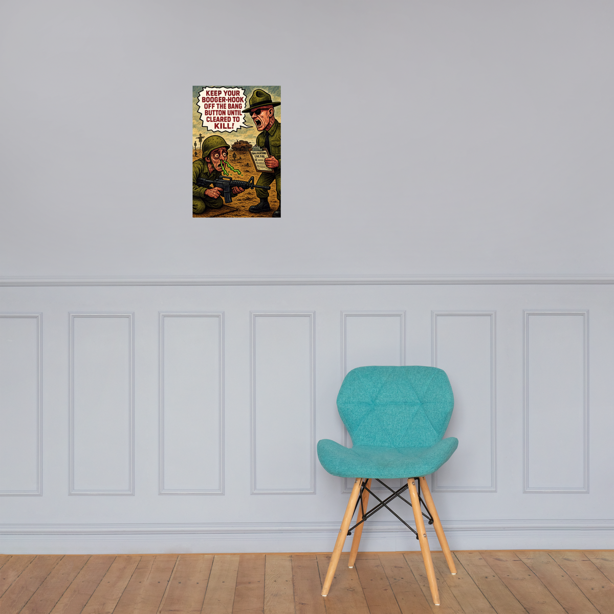 Keep Your Booger-Hook Off the Bang Button Until Cleared to Kill!: 12 in by 18 in glossy poster on a paneled wall above a turquoise chair; Printful room mockup.