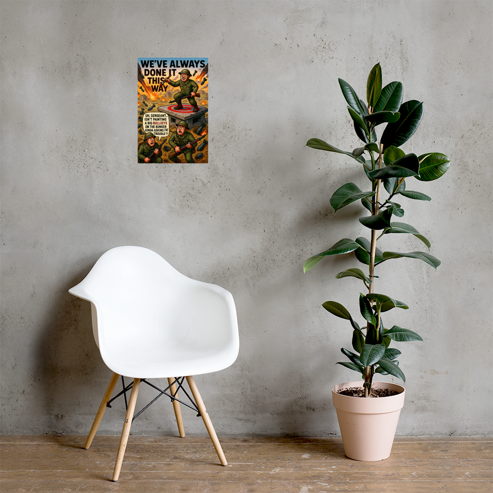 We've Always Done It This Way: 12 in by 18 in glossy poster on a concrete wall beside a white chair and plant; Printful room mockup.