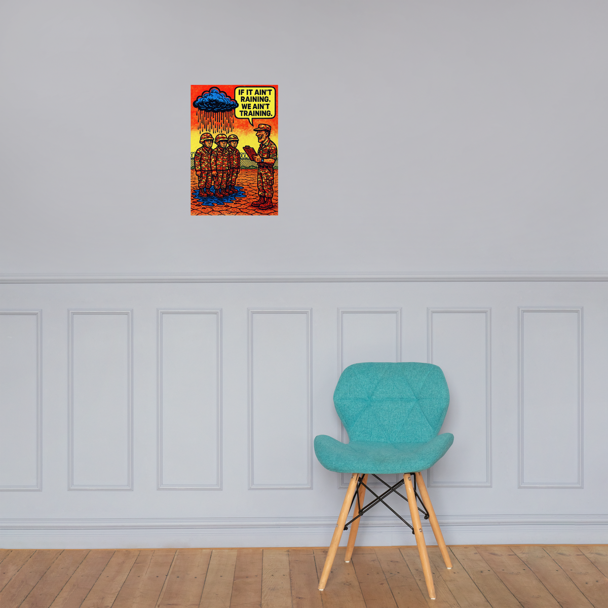 If It Ain't Raining, We Ain't Training 1: 12 in by 18 in glossy poster on a paneled wall above a turquoise chair; Printful room mockup.