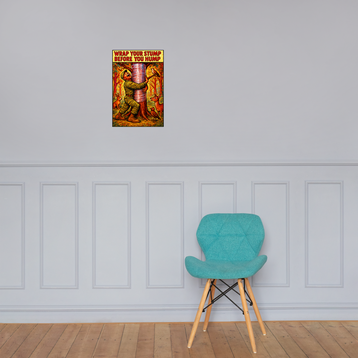 Wrap Your Stump Before You Hump: 12 in by 18 in glossy poster on a paneled wall above a turquoise chair; Printful room mockup.