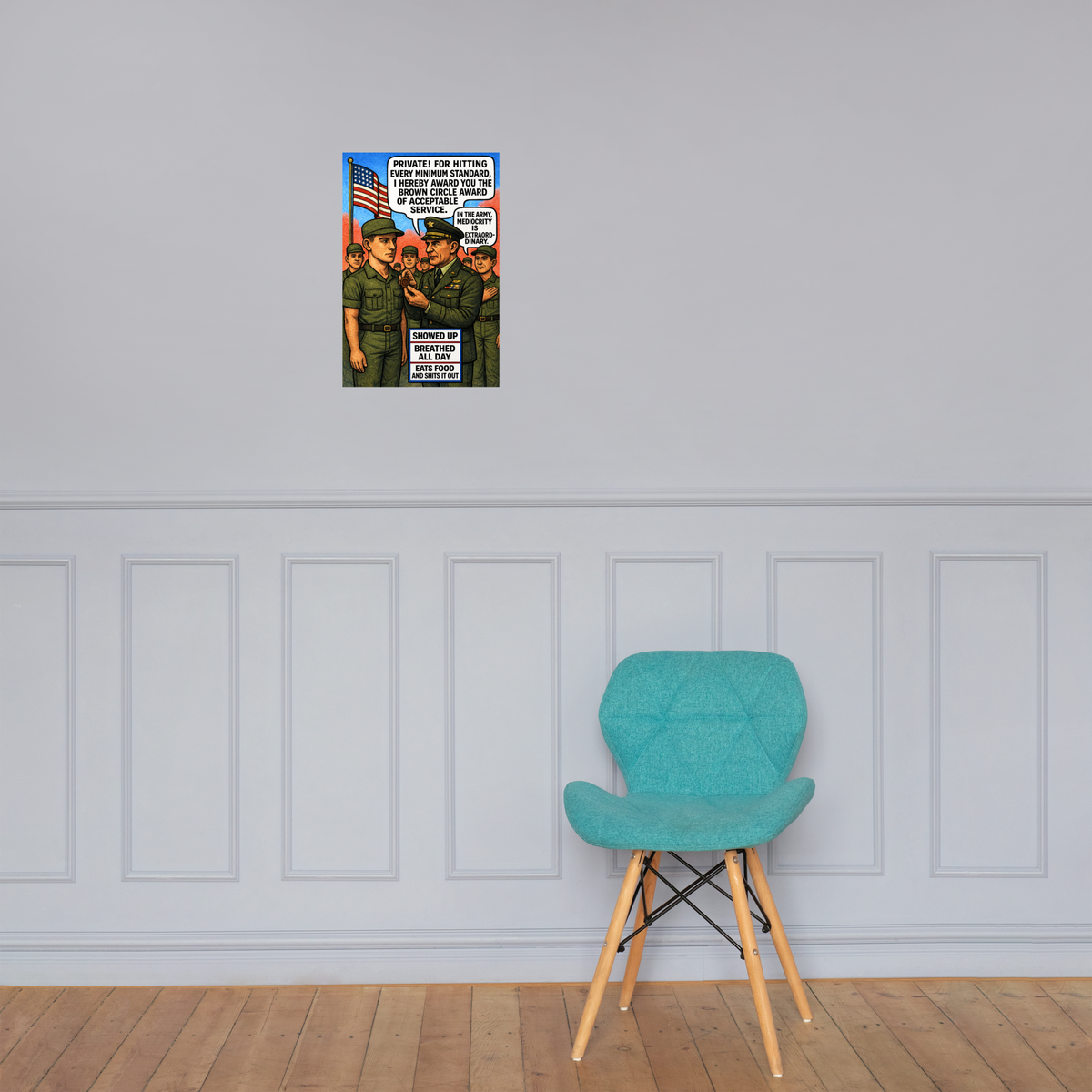 For Hitting Every Minimum Standard: 12 in by 18 in glossy poster on a paneled wall above a turquoise chair; Printful room mockup.