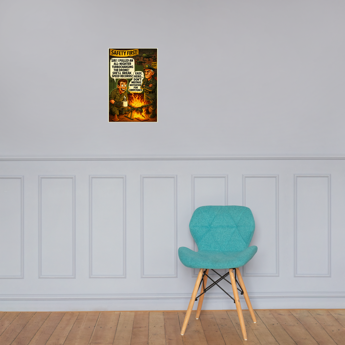 Safety First! 1: 12 in by 18 in glossy poster on a paneled wall above a turquoise chair; Printful room mockup.